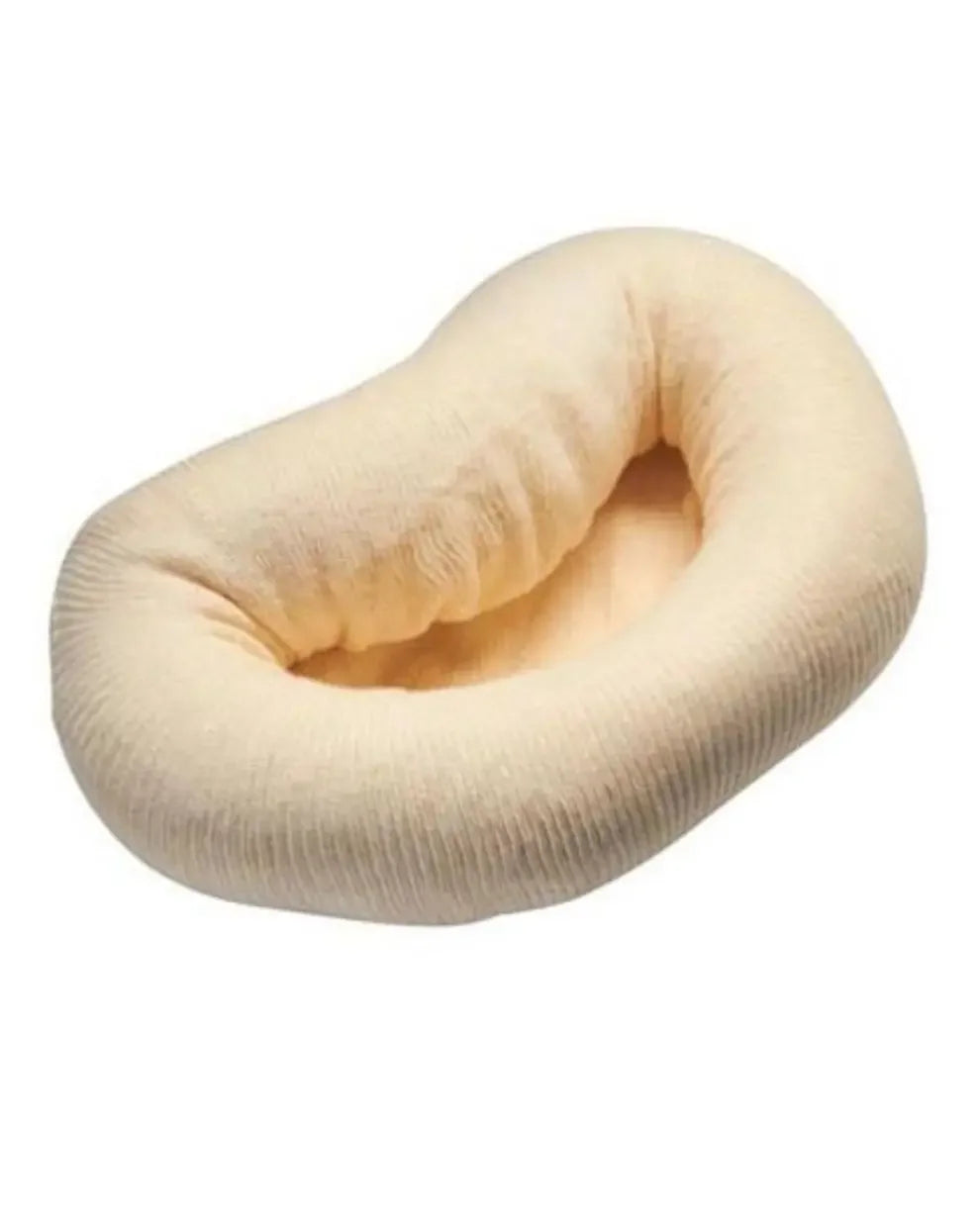 Cushioned, beige donut pillow for medical and home care support on a white background