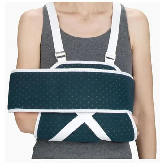 Person wearing orthopedic arm immobilizer sling for injury support