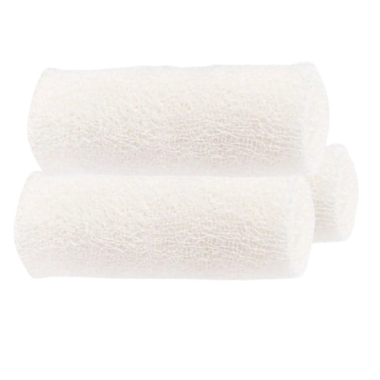 Three white rolled medical gauze bandages for wound care supplies