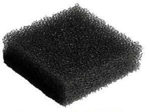 black medical foam filter pad on white background, used for respiratory or medical devices