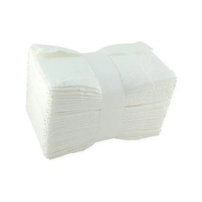 Stack of white disposable medical gauze pads for wound care and first aid