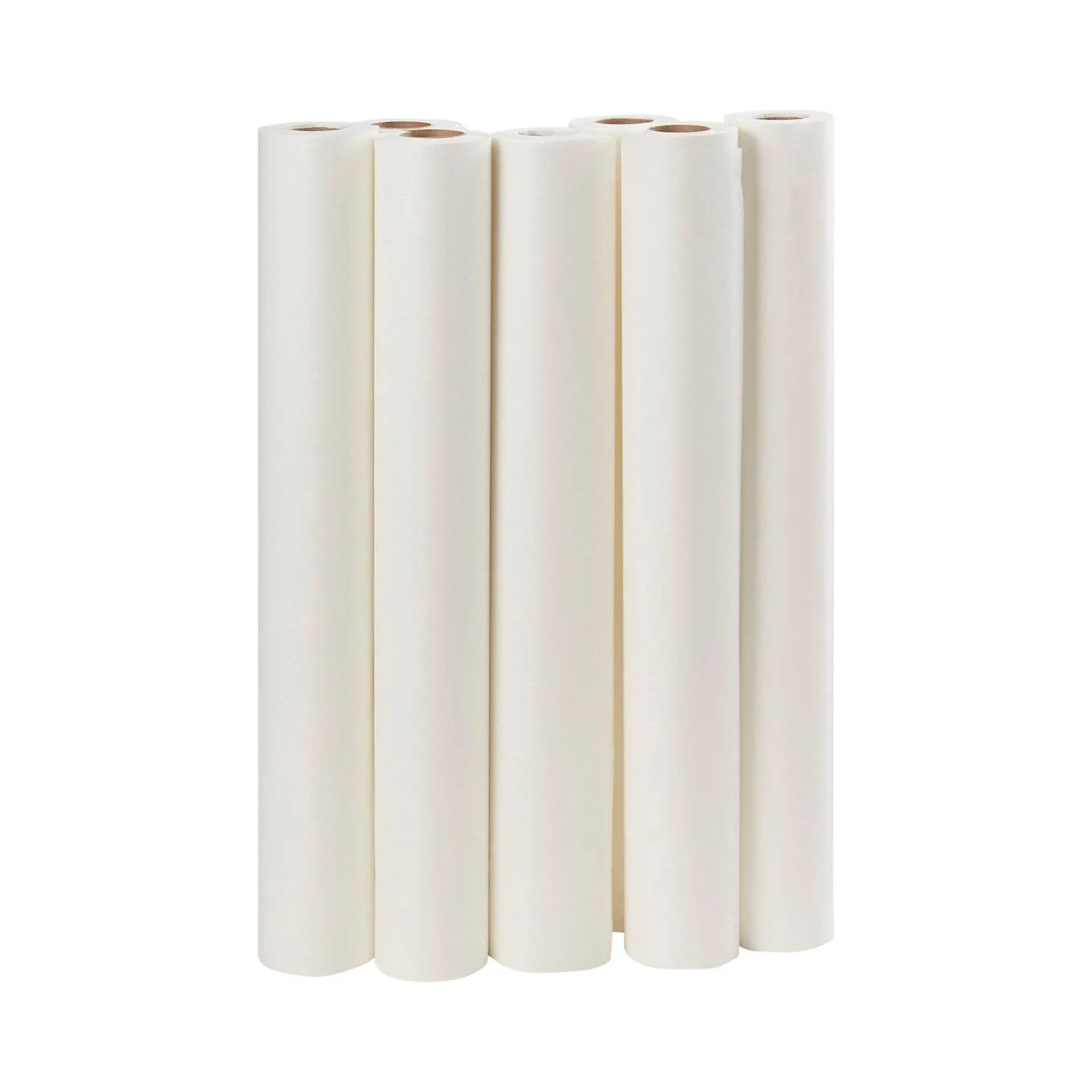Six rolls of white medical examination table paper standing upright on a white background