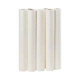 Six white medical paper rolls for exam tables on a plain background
