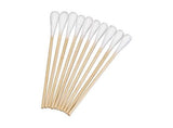 Wooden cotton tipped applicators for medical and home care use, arranged in a row