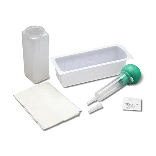 Medical ear irrigation kit with plastic container, bulb syringe, tray, and wipes