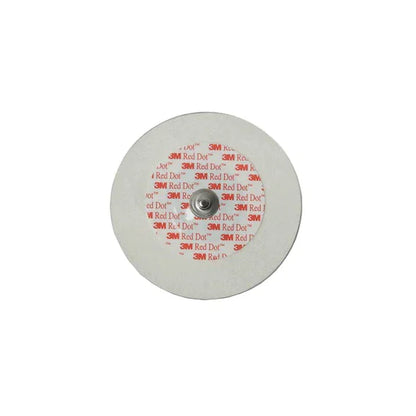 3M Red Dot round ECG electrode medical sensor with snap connector on white background