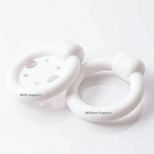 Two white medical pessary rings, one with support and one without support, on white background