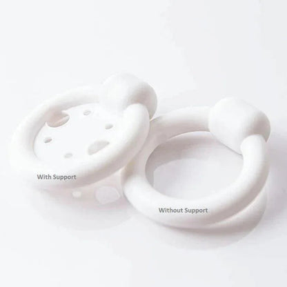 White medical pessary rings side by side, one with support and one without, on white background