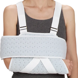 Person wearing orthopedic arm shoulder immobilizer brace for injury support