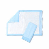Disposable blue and white underpad for medical incontinence care on white background