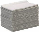 Stack of white disposable medical gauze pads for home care and clinical use