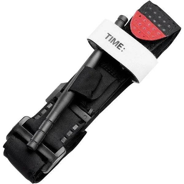 Black medical tourniquet with white time label and red safety tab for emergency first aid.