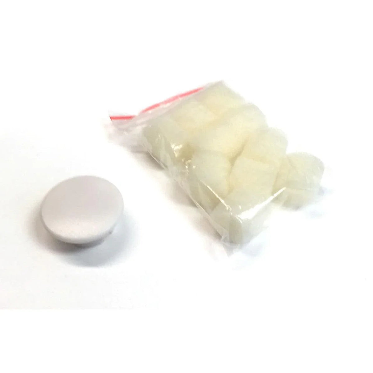 Sterile cotton balls in clear plastic bag with white plastic lid on white background