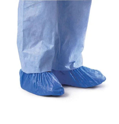 Disposable blue shoe covers on medical protective clothing for infection control