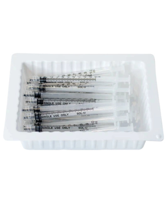 Disposable medical syringes in a white plastic tray, single use, home care supplies
