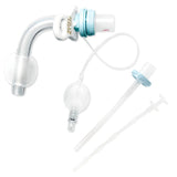 Tracheostomy tube with cuff, curved airway device, and included medical accessories on white background