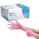 Pink nitrile exam gloves being worn, box of Medicom SafeBasics True Fit Thin gloves in background