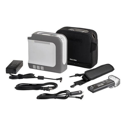 Portable oxygen concentrator kit with carrying case, battery, charger, and cables