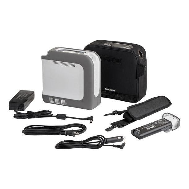 Portable oxygen concentrator kit with carry bag, charger, and accessories on white background