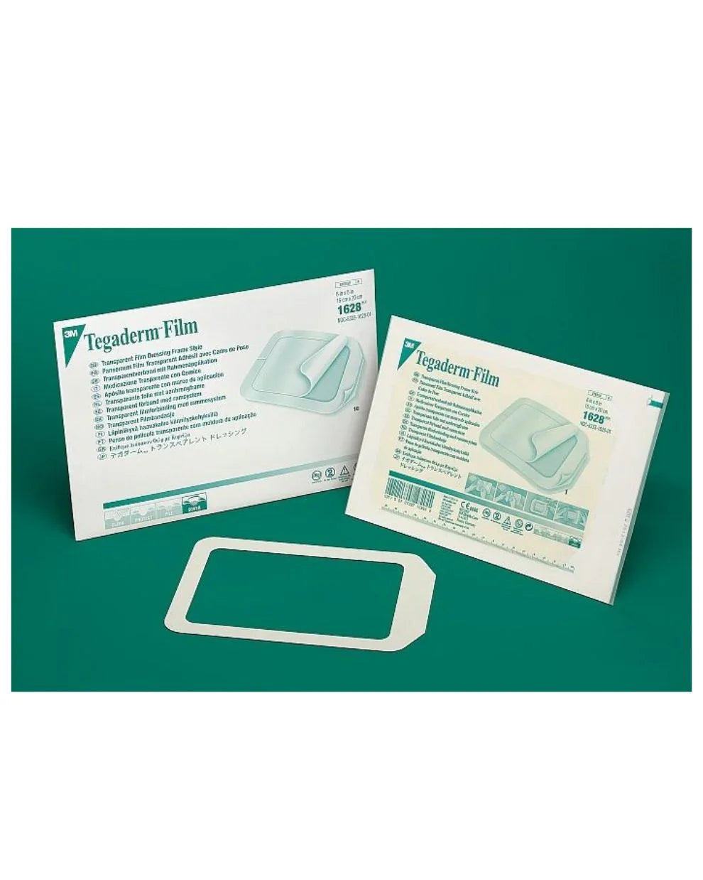 3M Tegaderm Film transparent wound dressing bandage boxes with film sheet on green background