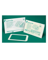 3M Tegaderm Film 1629 transparent wound dressing with packaging on green background