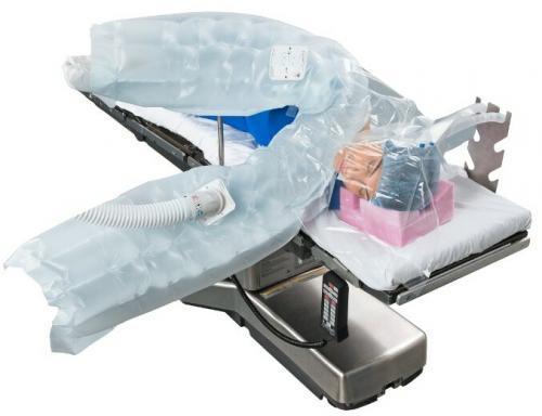 Upper body warming blanket system on hospital bed, patient covered for temperature management