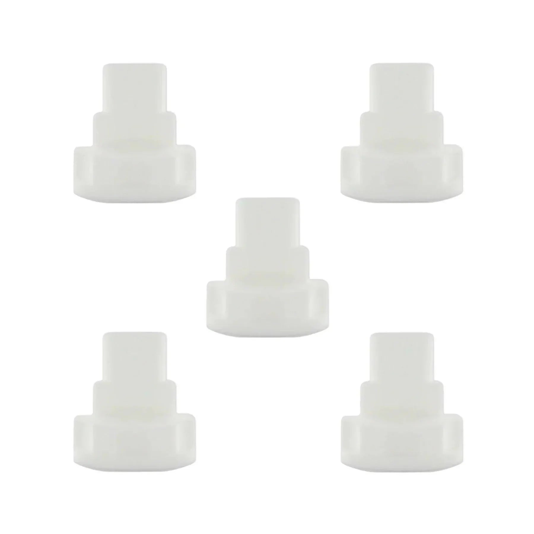 Five white plastic oxygen tubing connectors for medical respiratory supplies