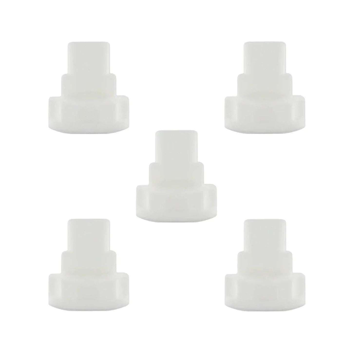 Five white plastic medical tubing connectors on a white background