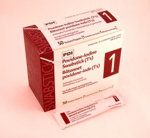 Box of PDI povidone-iodine swabsticks for antiseptic and wound care, with single swab packet.