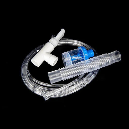 Medical nebulizer kit with tubing, mouthpiece, T-piece and medication chamber on black background