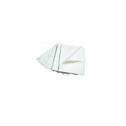Stack of white disposable medical underpads for home and healthcare use on white background