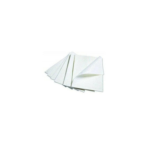 Stack of white disposable medical underpads for home and healthcare use on white background
