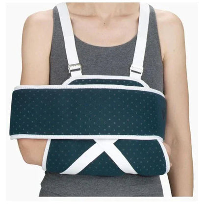 Person wearing orthopedic arm immobilizer sling for injury support