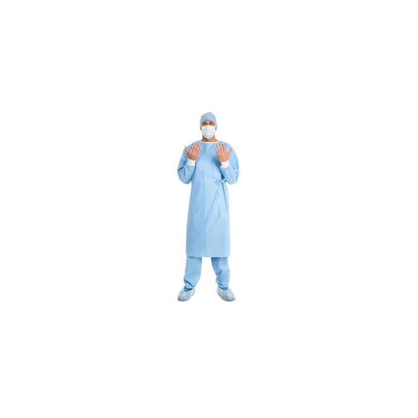 Medical professional in blue disposable surgical gown, face mask, cap, gloves, and shoe covers