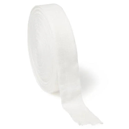 White medical gauze roll for wound care and bandaging on white background