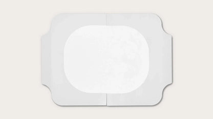 Sterile adhesive medical dressing pad on a white background, wound care supply