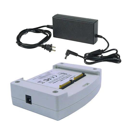 Medical battery charger with power adapter and charging base, white and black, on white background
