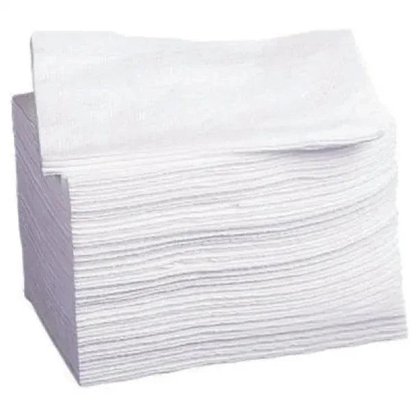 Stack of white disposable dry wipes for medical or home care use