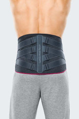 Back view of person wearing adjustable lumbar back support belt for pain relief