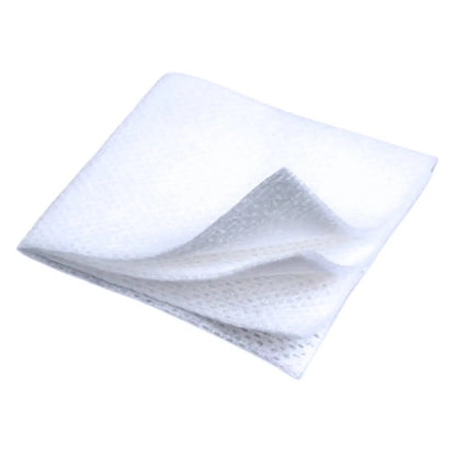 Sterile medical gauze pad for wound care and dressing, white, folded, closeup