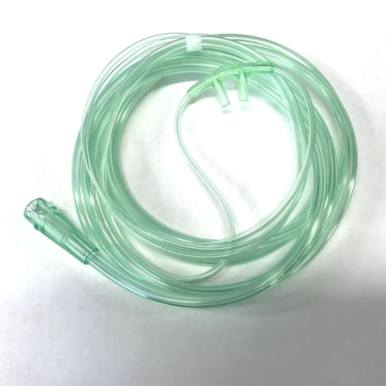 Coiled nasal oxygen cannula tubing for respiratory medical use on white background
