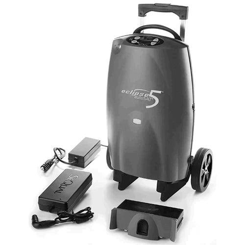 Portable oxygen concentrator with wheels, charging cables, and power adapter for home care