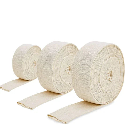 Three rolls of elastic tubular bandage in different sizes for medical and wound care