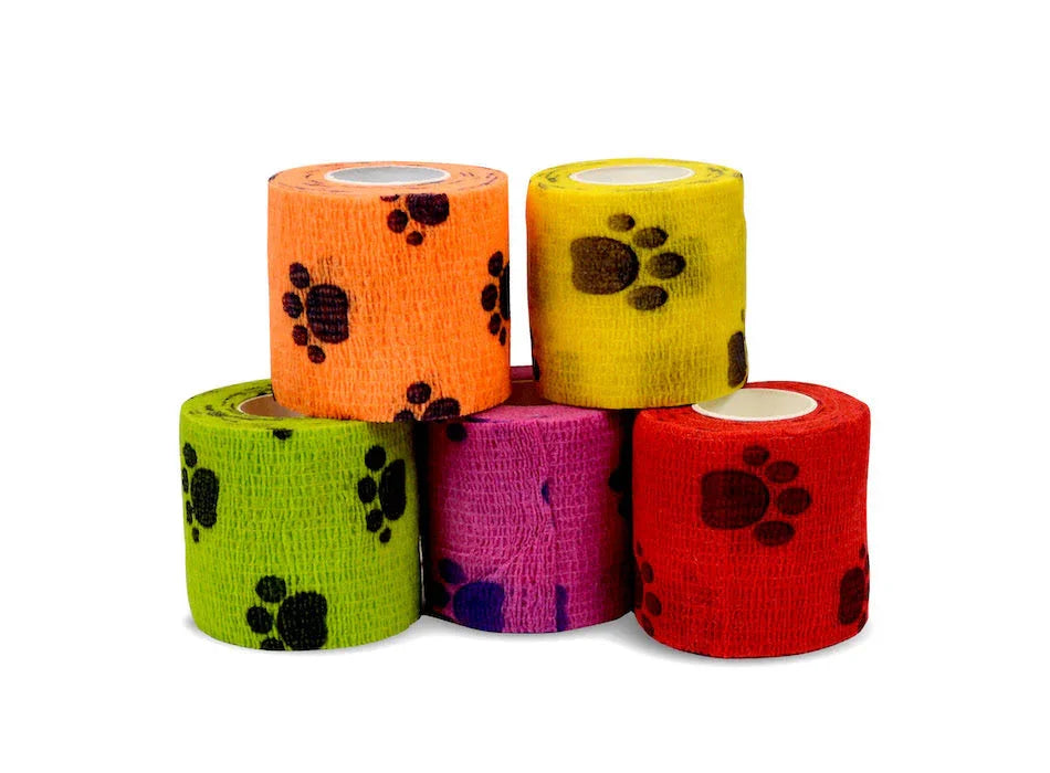 Colorful self-adhesive bandage rolls with paw print pattern for medical or veterinary use