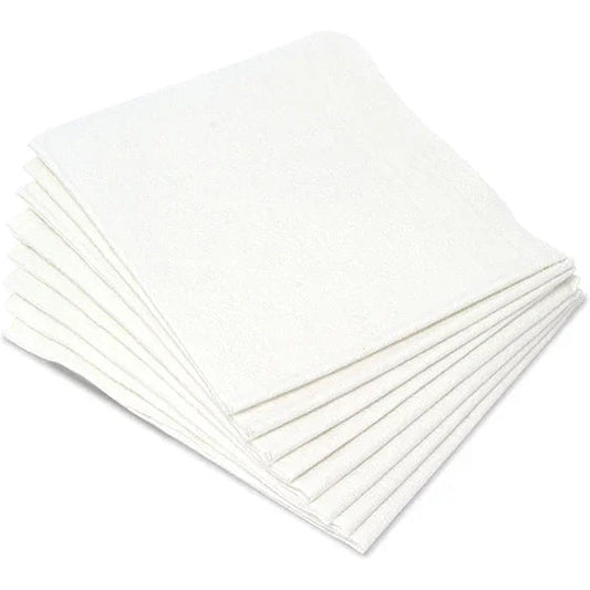 Stack of white disposable medical towels for home care or esthetic use on white background