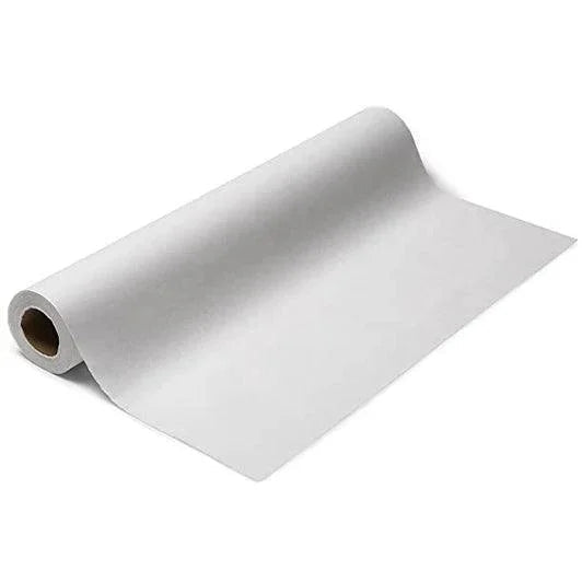 White disposable medical exam table paper roll on a plain background