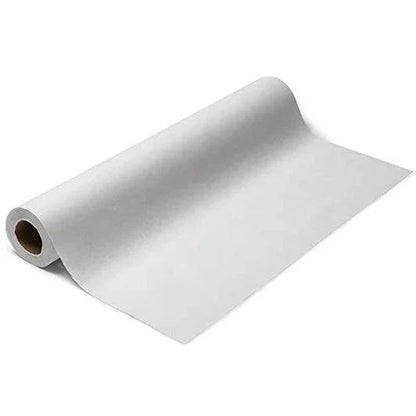 White disposable medical exam table paper roll on white background