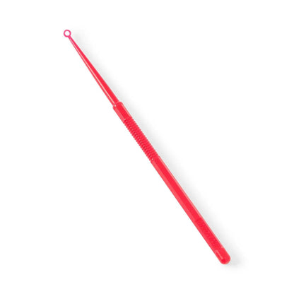 Red plastic medical comedone extractor tool with textured grip on white background