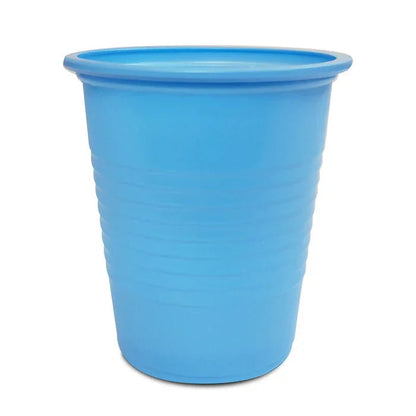 Blue disposable plastic medical cup with ridged sides, isolated on white background
