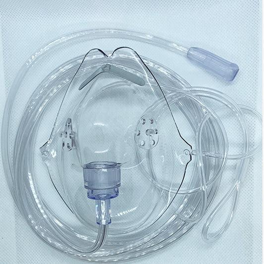 Clear oxygen mask with tubing for respiratory therapy on white background